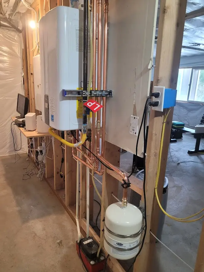 Licensed plumber repairing a kitchen sink in Minerva