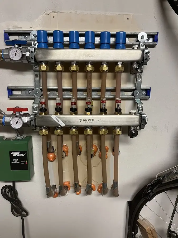 Plumber performing Water Heater Repair at a residential property in Minerva